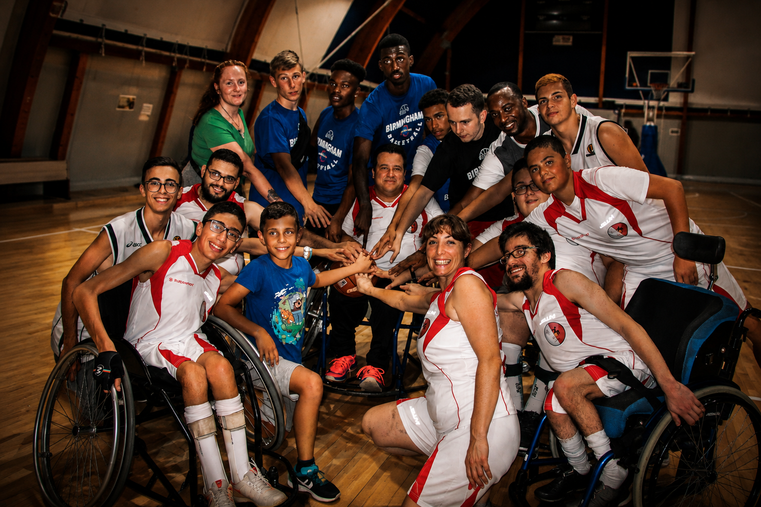 Malta Wheelchair Basketball Association team and volunteers together on court